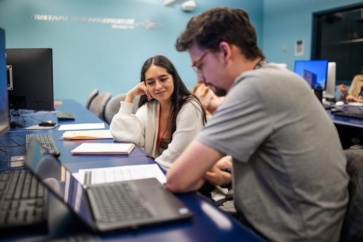 Incoming Veterans and transfer students speak with advisors during orientation at MSU Denver on Aug. 9, 2023. Photo by Alyson McClaran